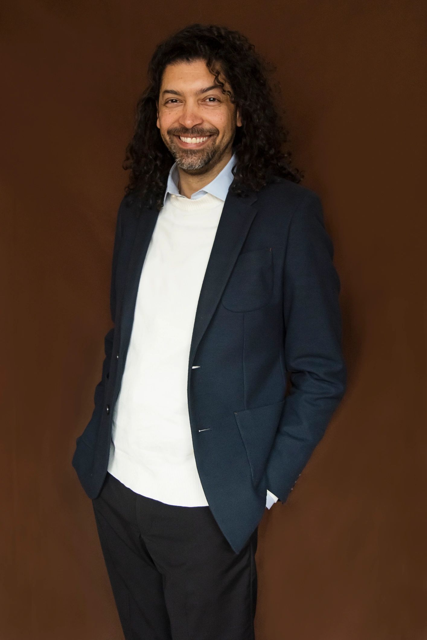 Portrait of a professional team member with curly hair