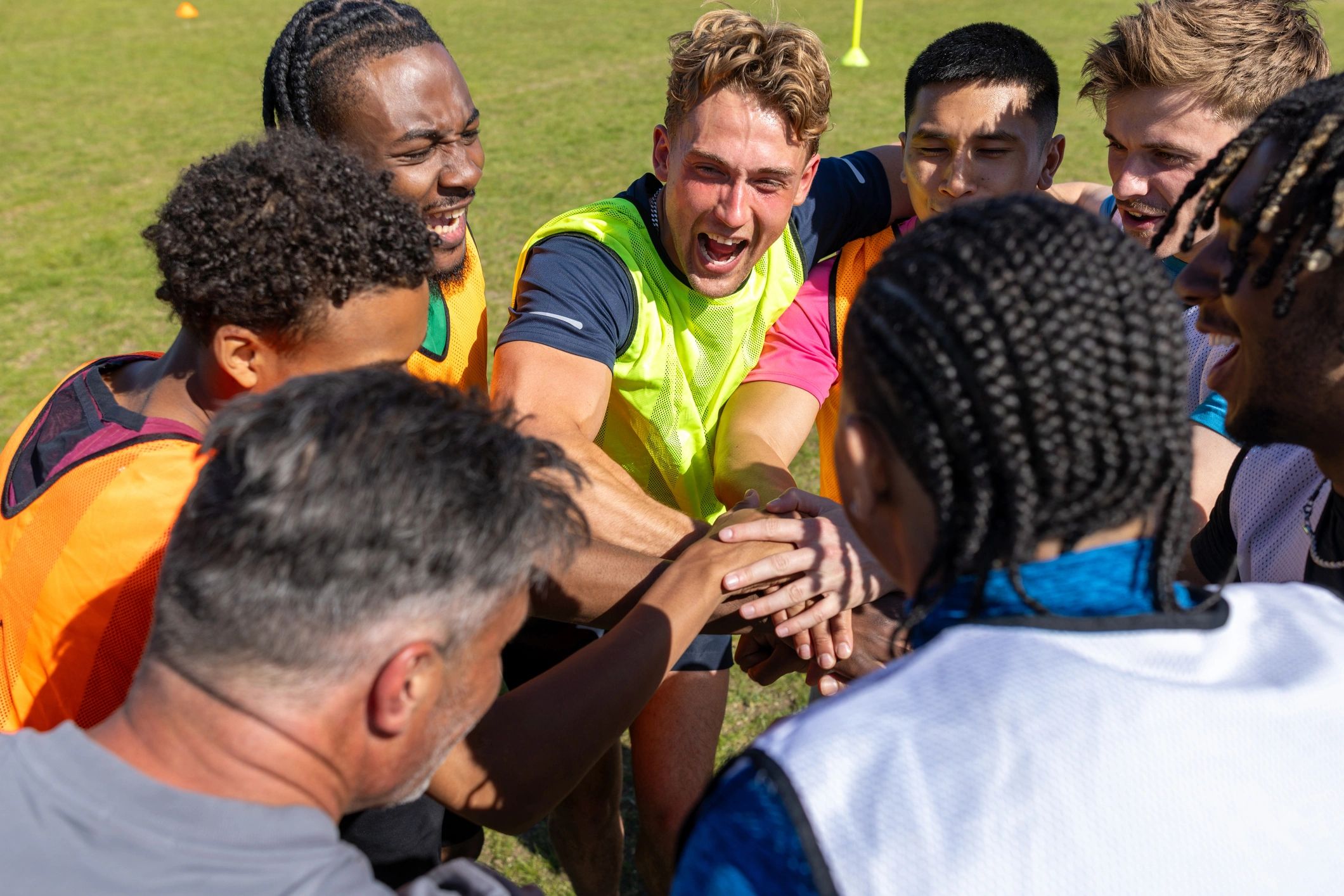 Football players huddling before a match